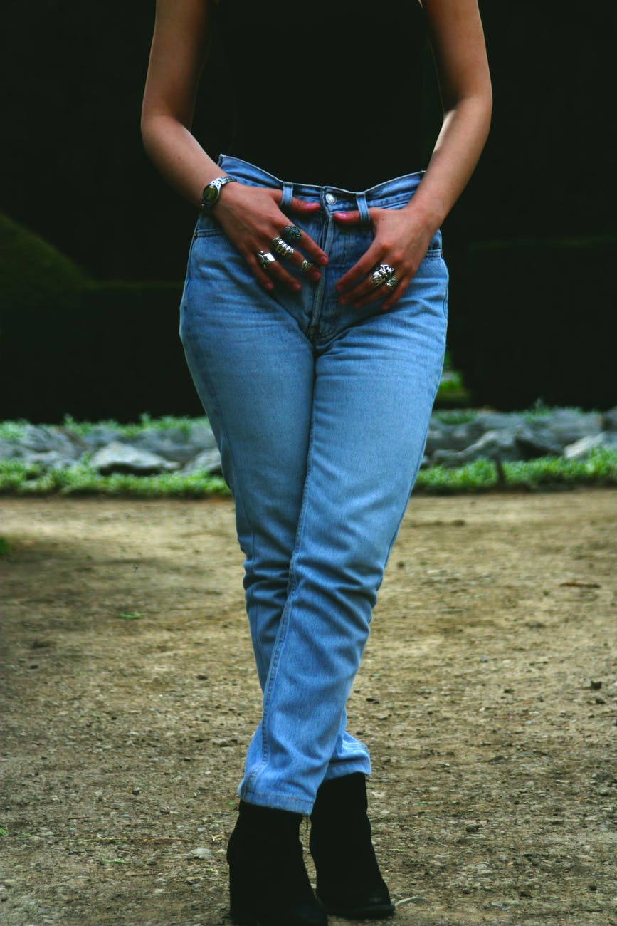 woman holding her jeans